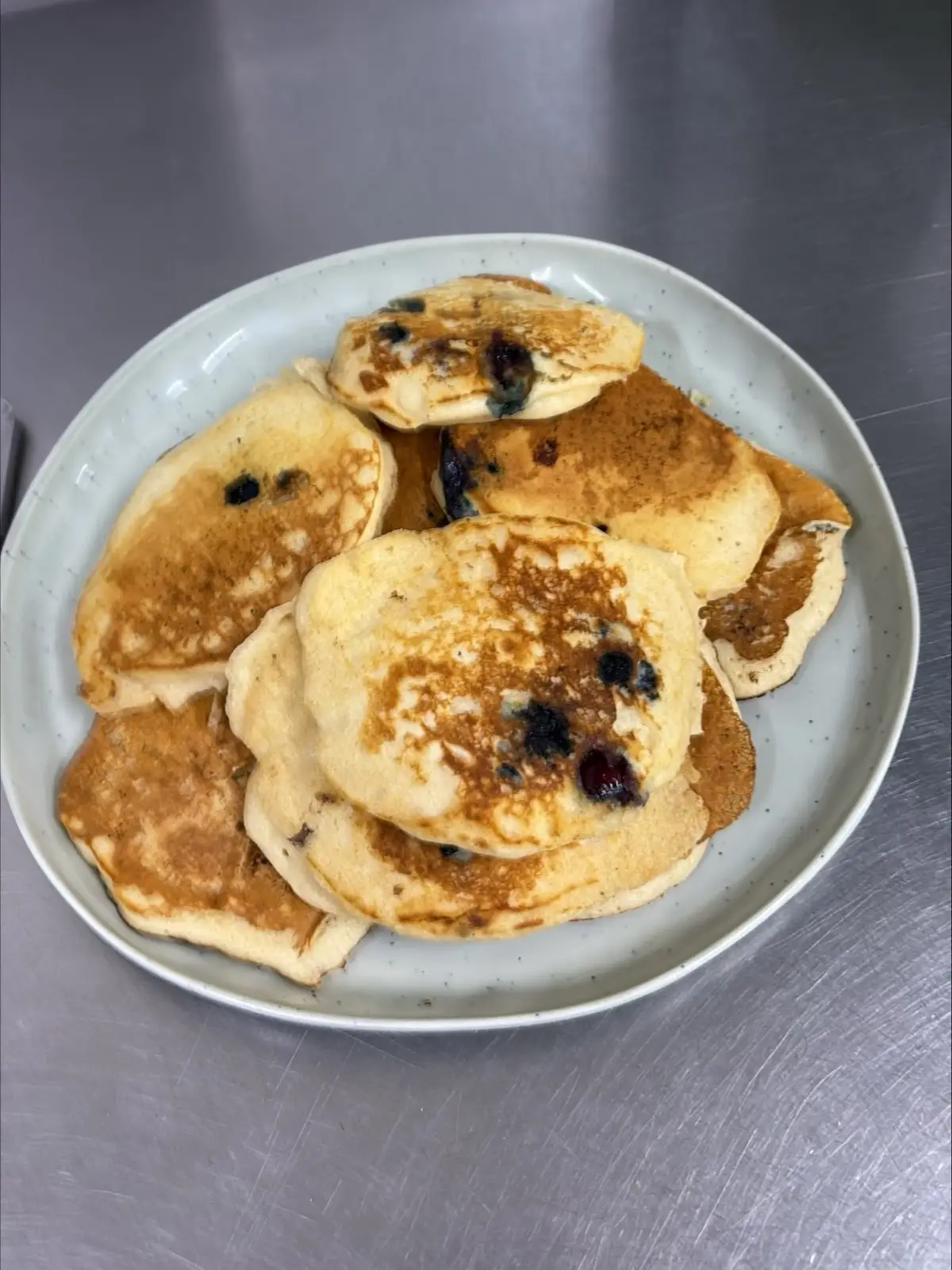 Plate of blueberry pancakes in the Christine Court kitchen